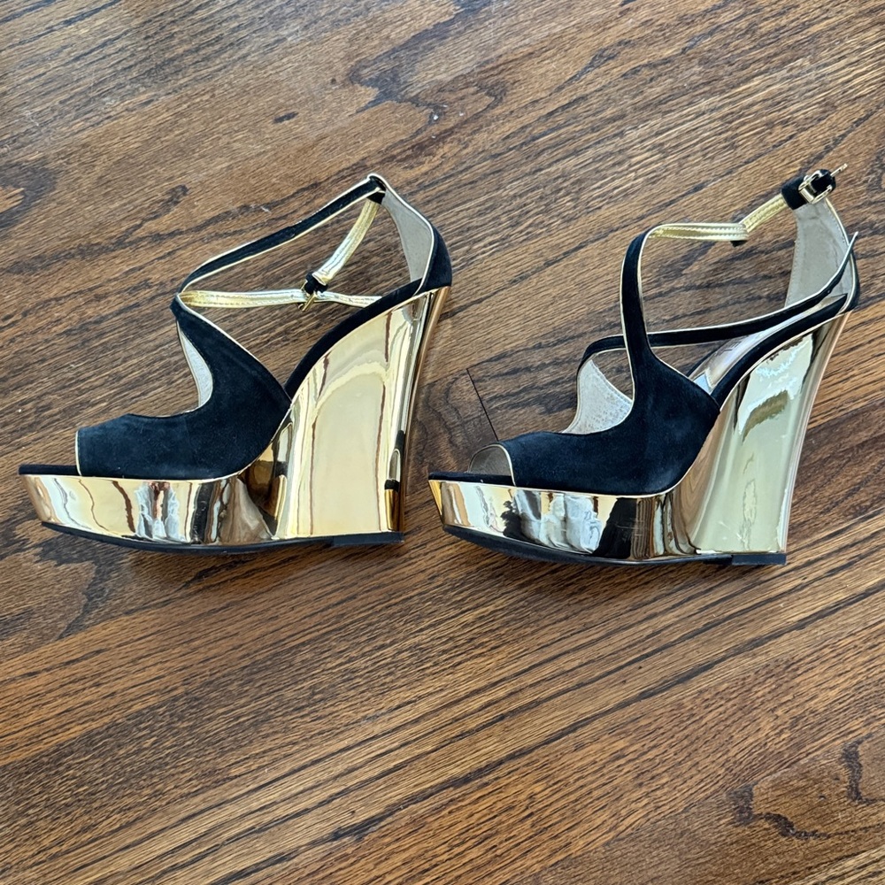 Michael Kors Black and Gold Wedges Size 7 but fit a size 8. See description.